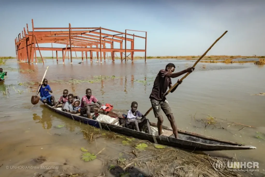 Nyeritea Kay Nakney and her four children and two nephews arrive in Bentiu after being forced to flee their flooded village.
